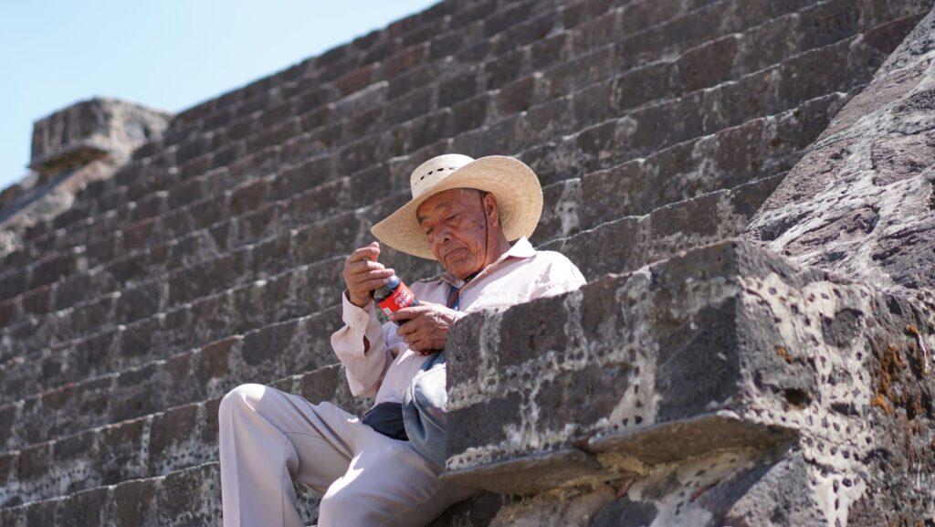 man drinking coca cola mexico