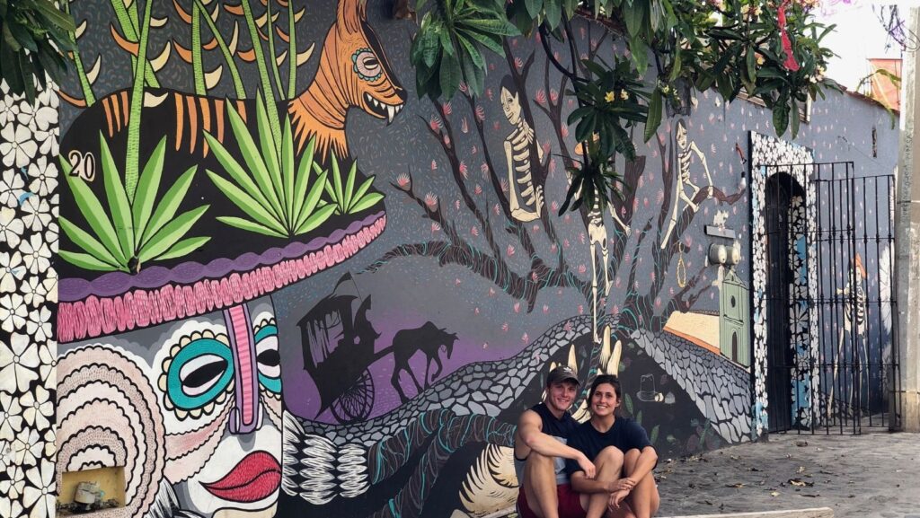 jules and marius in front of bouler, graffiti street art mural from artist in oaxaca