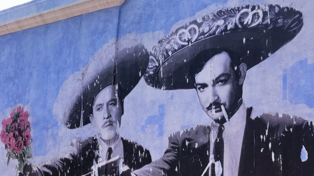 blue mural on the street in oaxaca, mexico