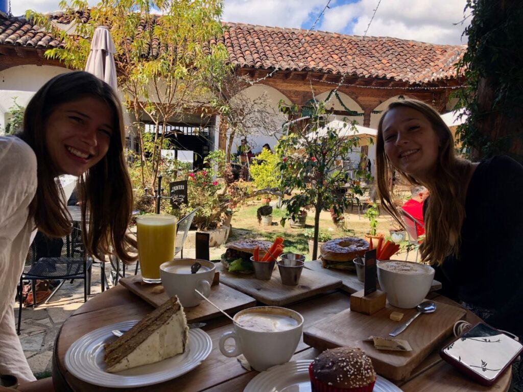 coffee and cake on the table at Frontera Artisan Food and Coffee, a cafe in San Cristobal