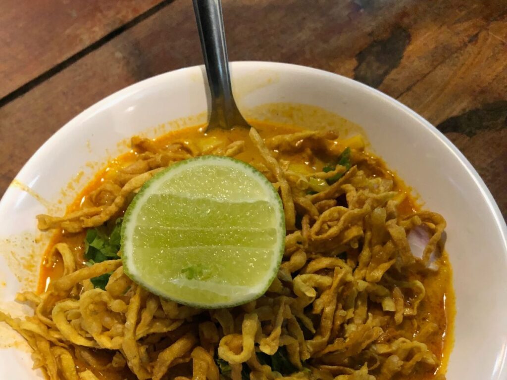 upclose shot of a bowl of khao soi from walking street in pai