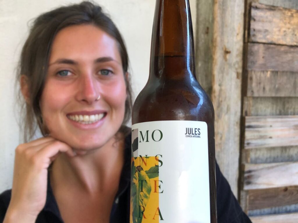 Jules holding a beer in Frontera Artisan Food and Coffee in san cristobal de las casas