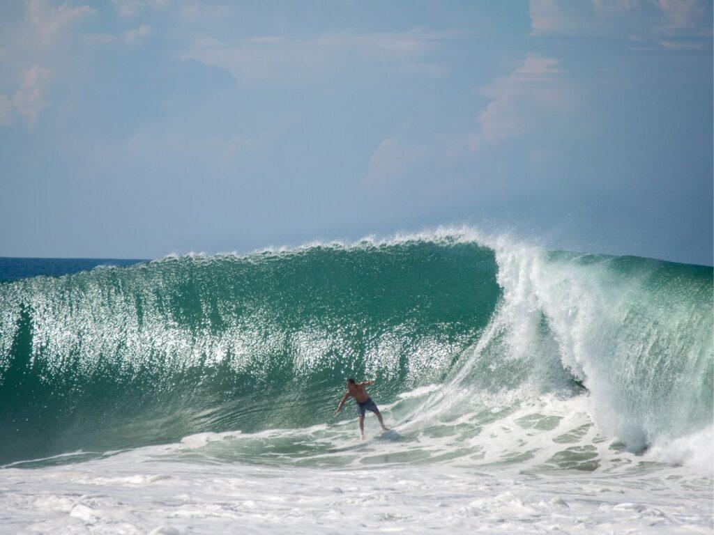 man surfing big wave in puerto escondido