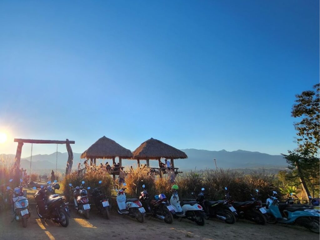 two huts bar at sunset in pai norther thailand, blue skies