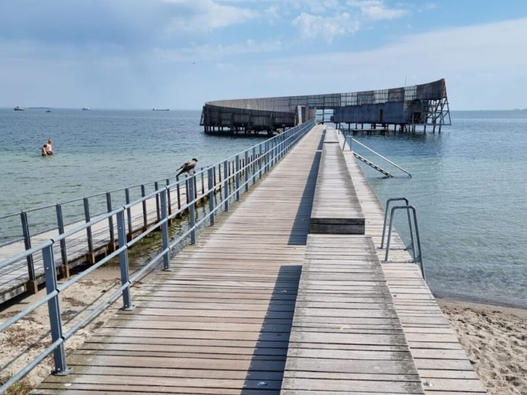 the pier to kastrup sea bath, an outdoor swimming spot in Copenhagen, blue cold water