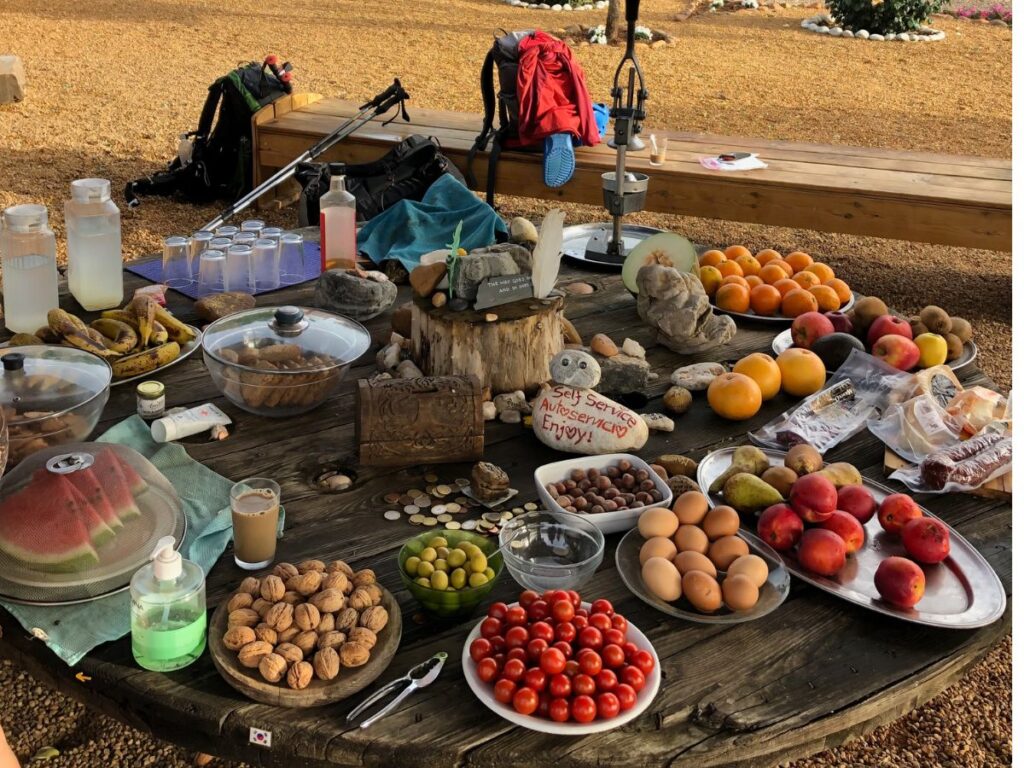 generous donativo stall with fruit and cereal on camino de frances