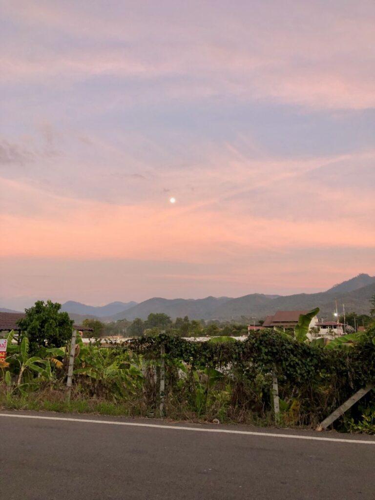 driving along the road at sunset in pai, thailand