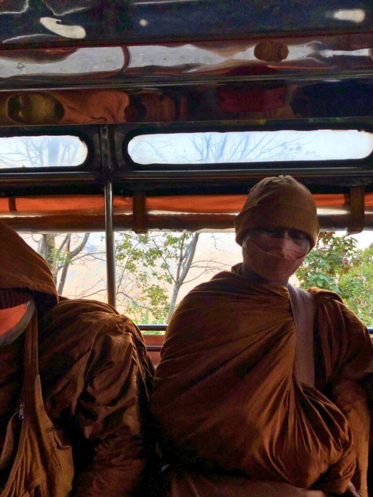 monks on bus on the way to wat pa tam monastery, northern thailand