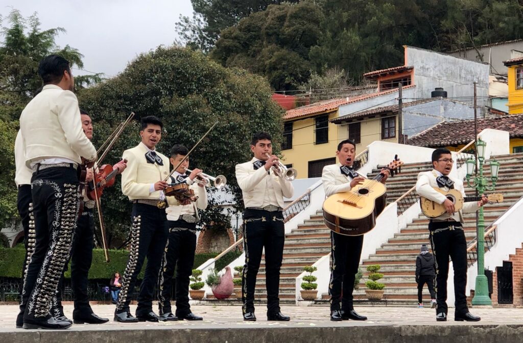 mexican band playing at the square of barrio de le merced