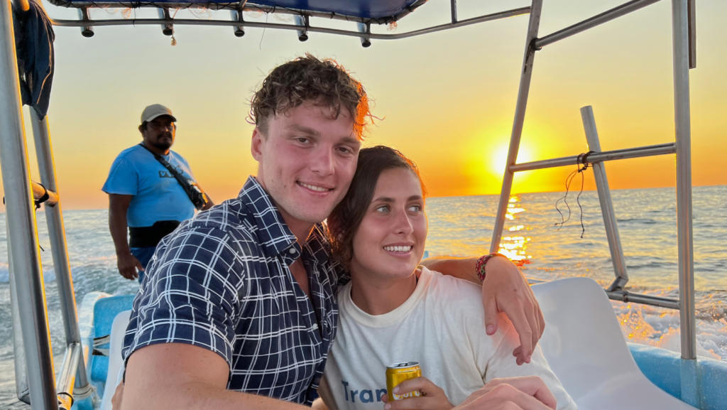 couple on a boat trip at sunset on the coast of Puerto Escondido