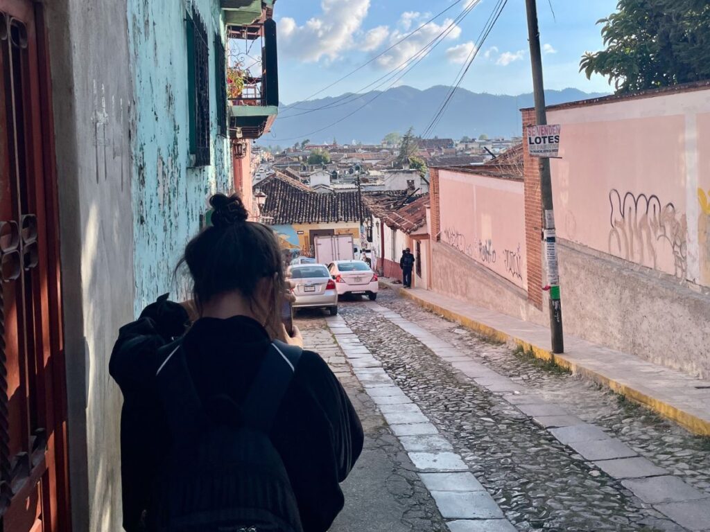 Jules from Real Talk Travel walking on streets of San Cristobal de las Casas, Mexico