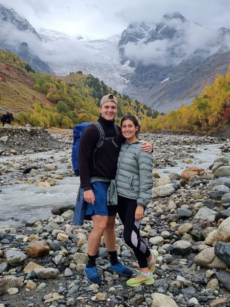 boy and girl standing next to each other on mestia to ushguli hike