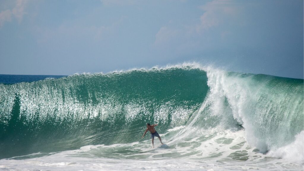 big wave surfer on zicatela beach, puerto escondido