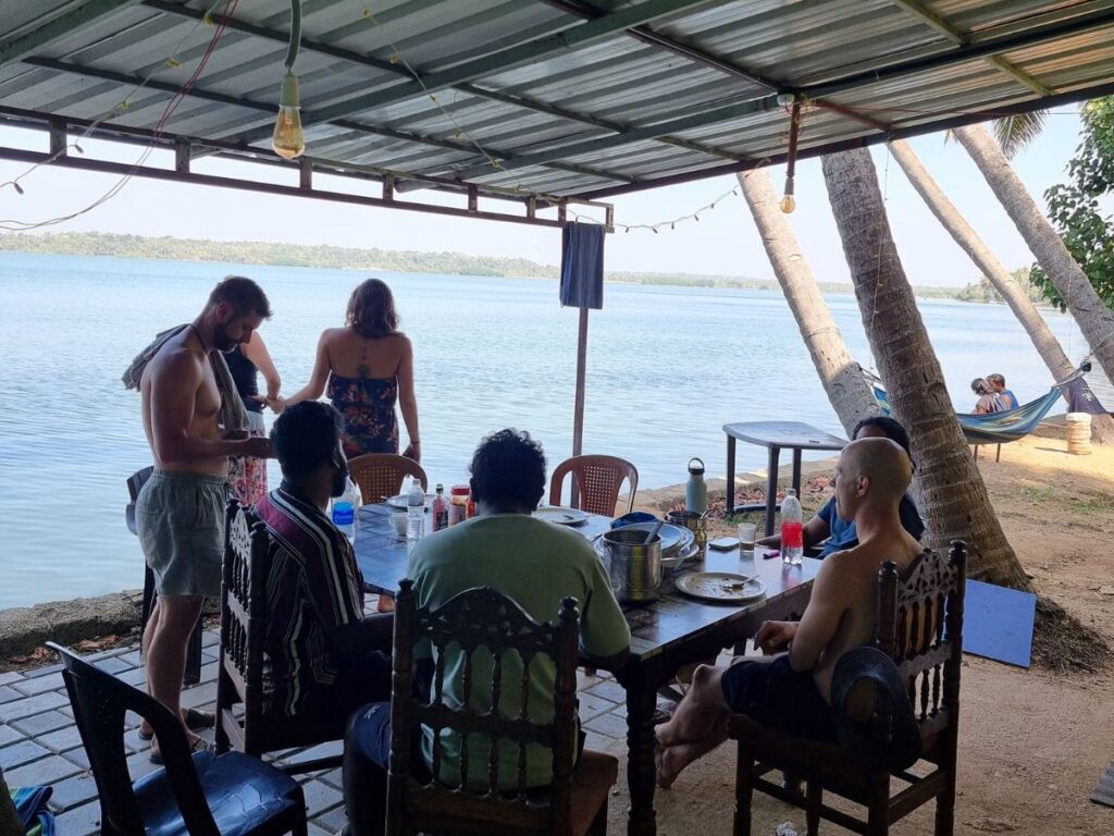 travellers gathered outside santa maria hostel munroe island