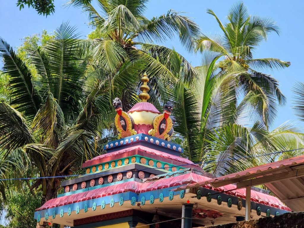 beautiful colours exterior of Shiva Paravati Vishnu Temple on Golden Island, Kerala