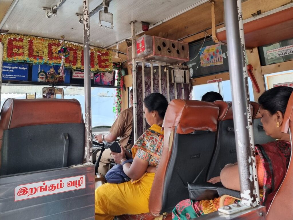 Three Indian ladies sitting on public bus travelling from Coonoor to Coimbatore