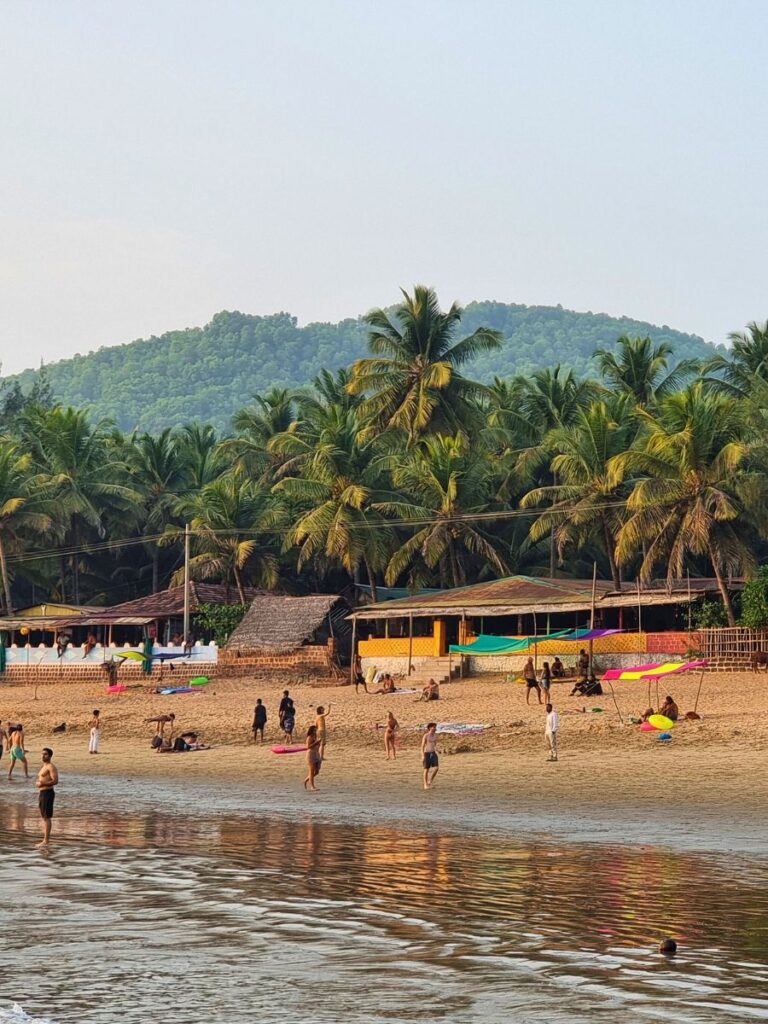 Locals and travellers gathered on Om Beach, Gokarna, Karnataka.