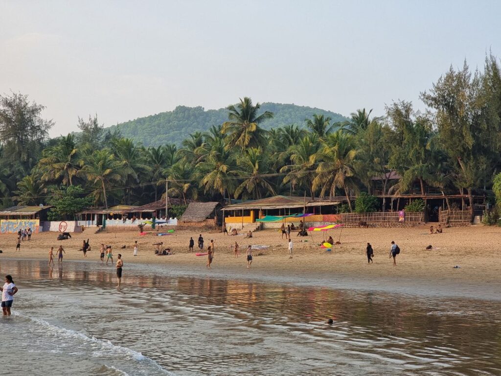 Locals and travellers gathered on Om Beach, Gokarna, Karnataka