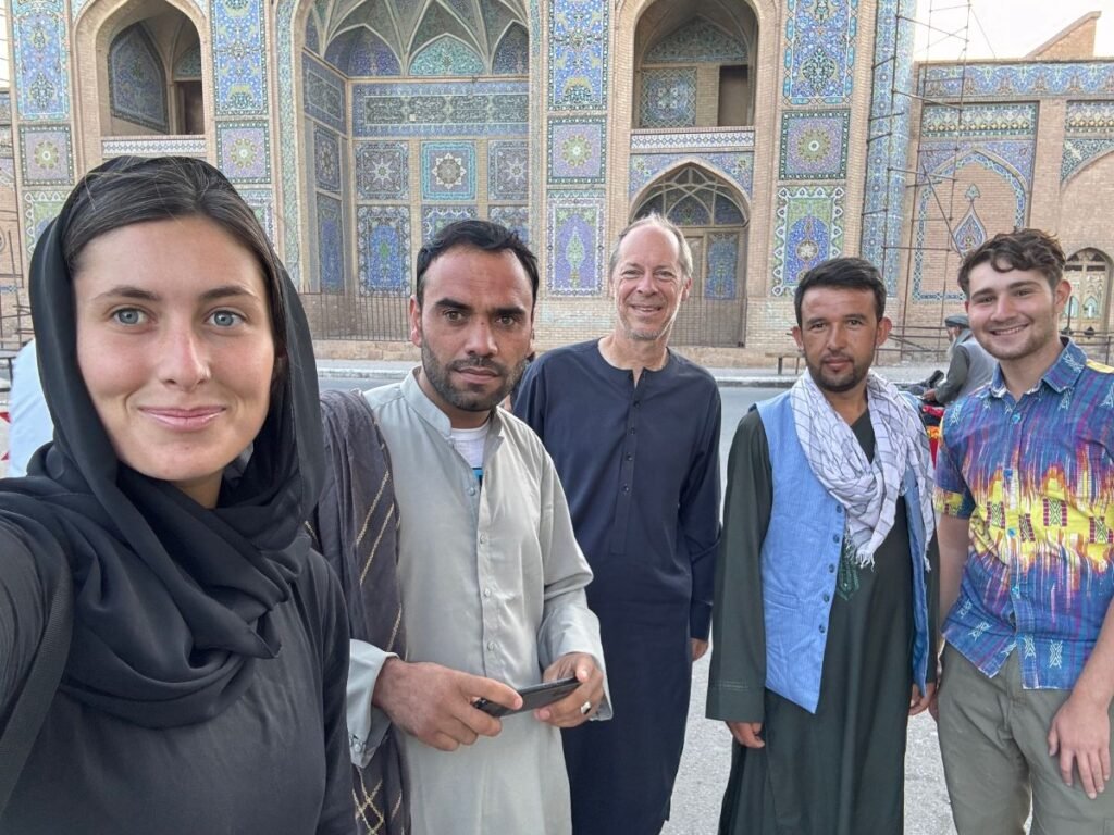 Tourists with warm locals in herat afghanistan