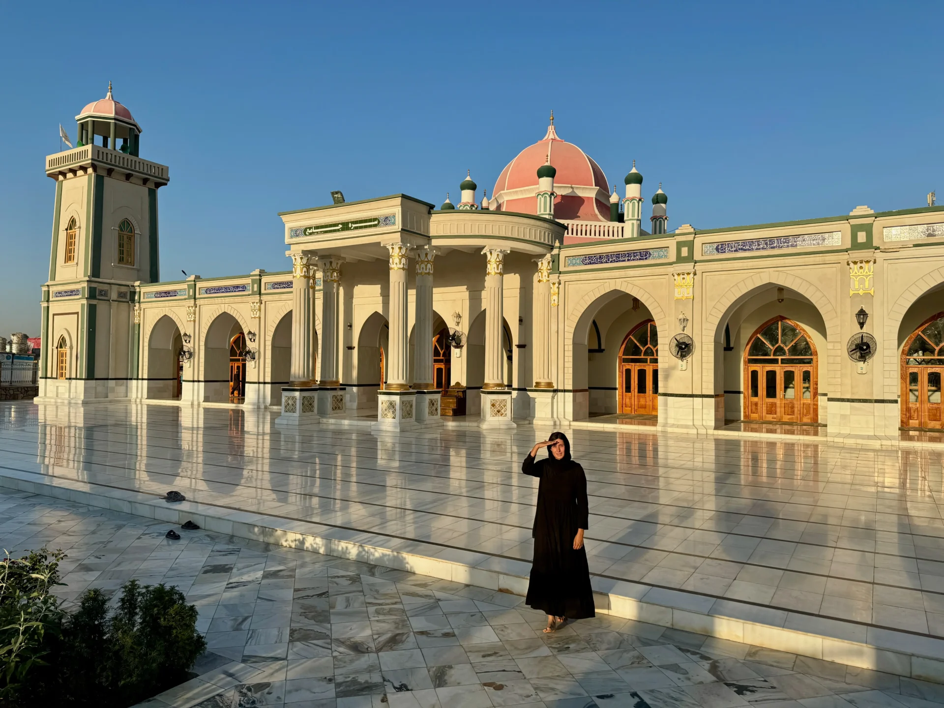 Jules, a female solo traveller standing in front of Red Mosque in Kandahar, Afghanistan