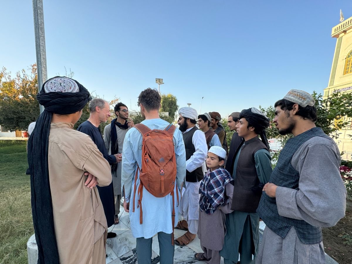 Locals surrounding tourist in Kandahar, Afghanistan