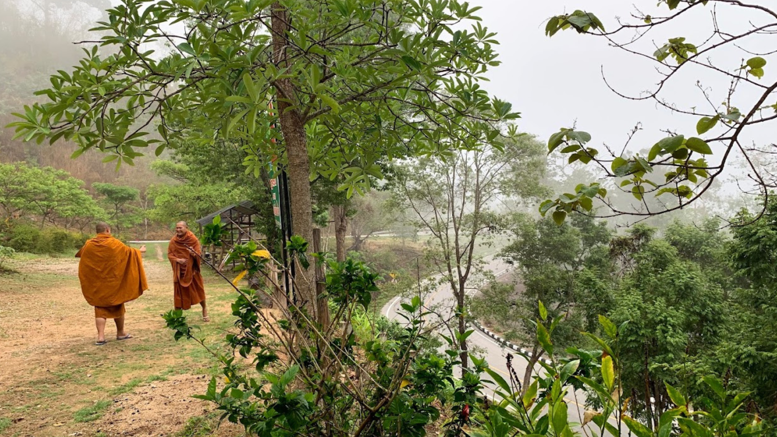 Monks standing on side of road on way to Pai