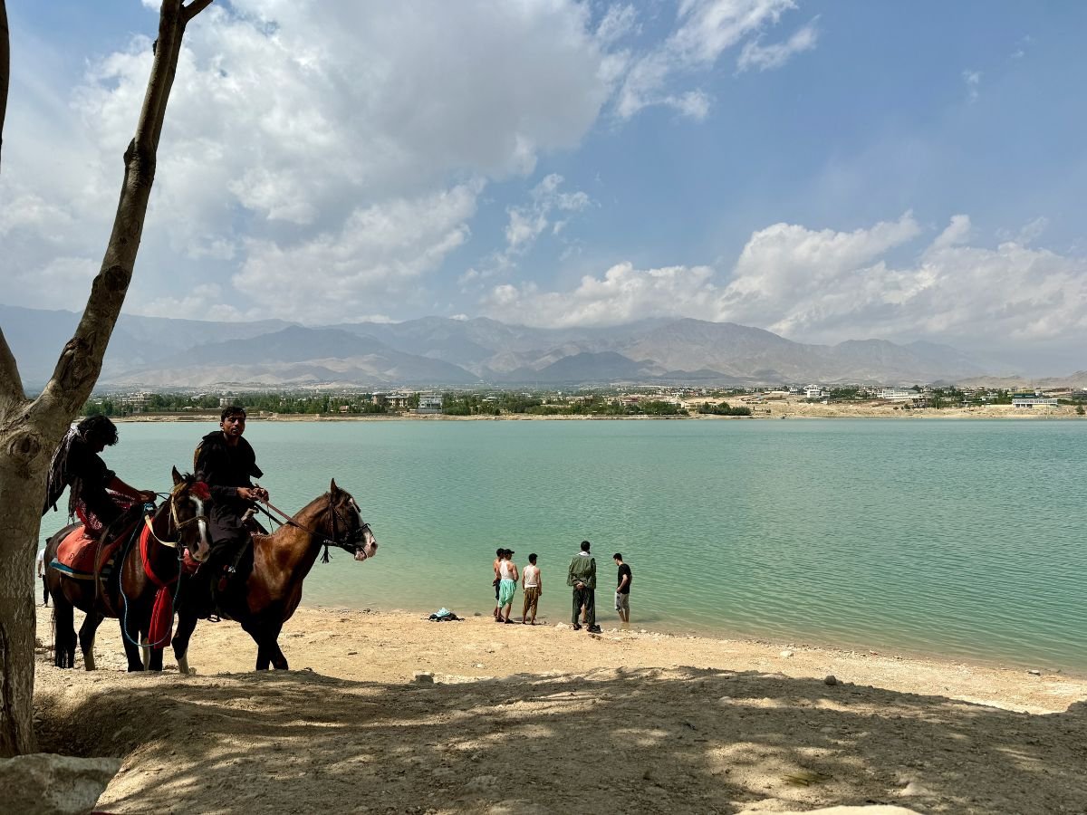 Local men swimming at Qargha Reservoir, Afghanistan