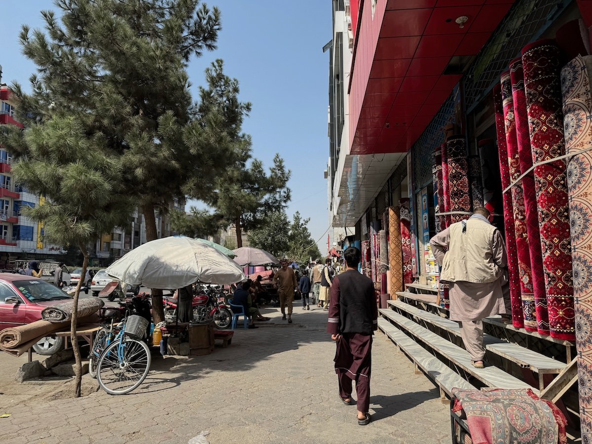 Boy walkng down street in Kabul, Afghanistan