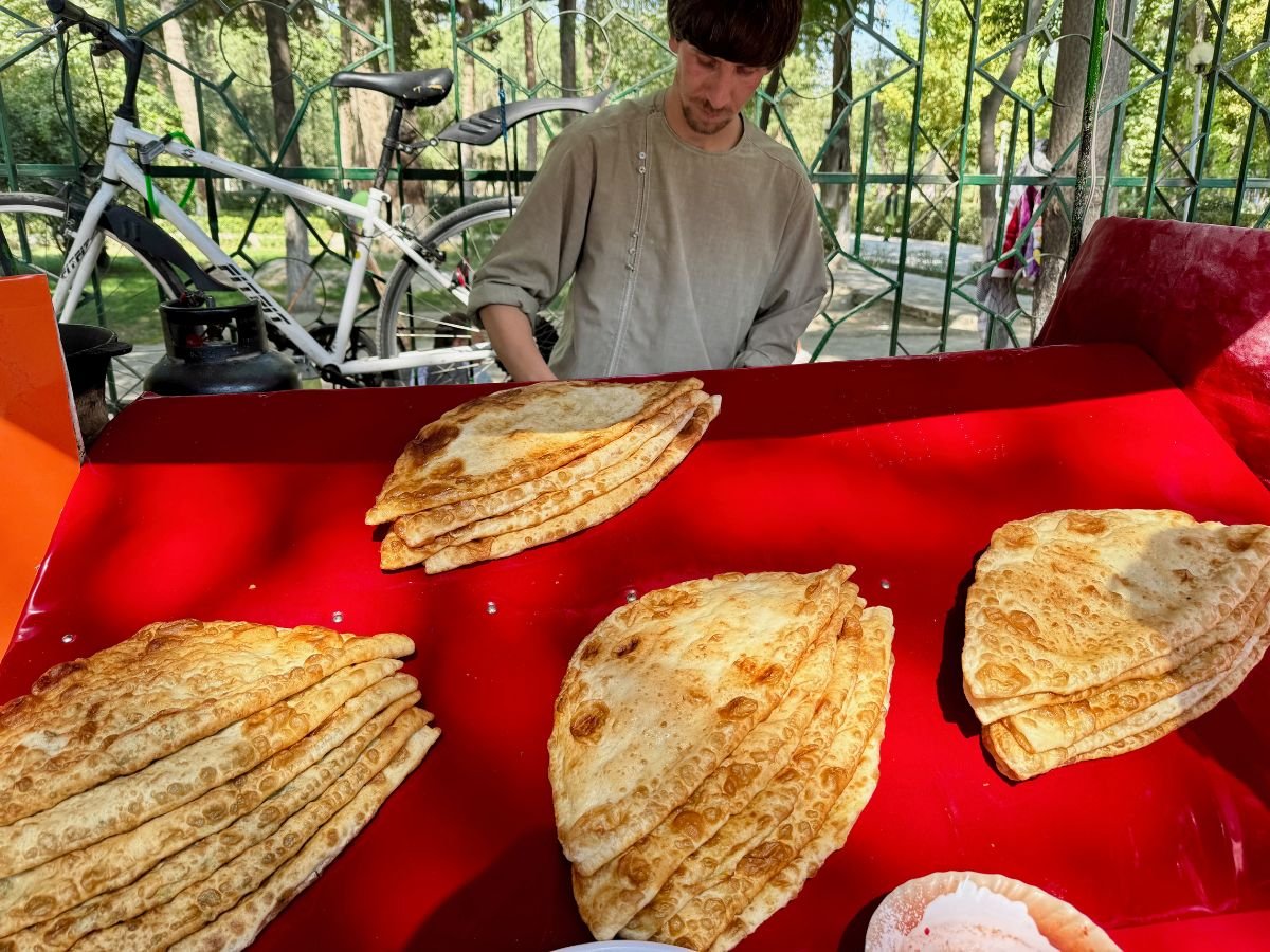 Street vendor selling bread next to park in Kabul, Afghanistan