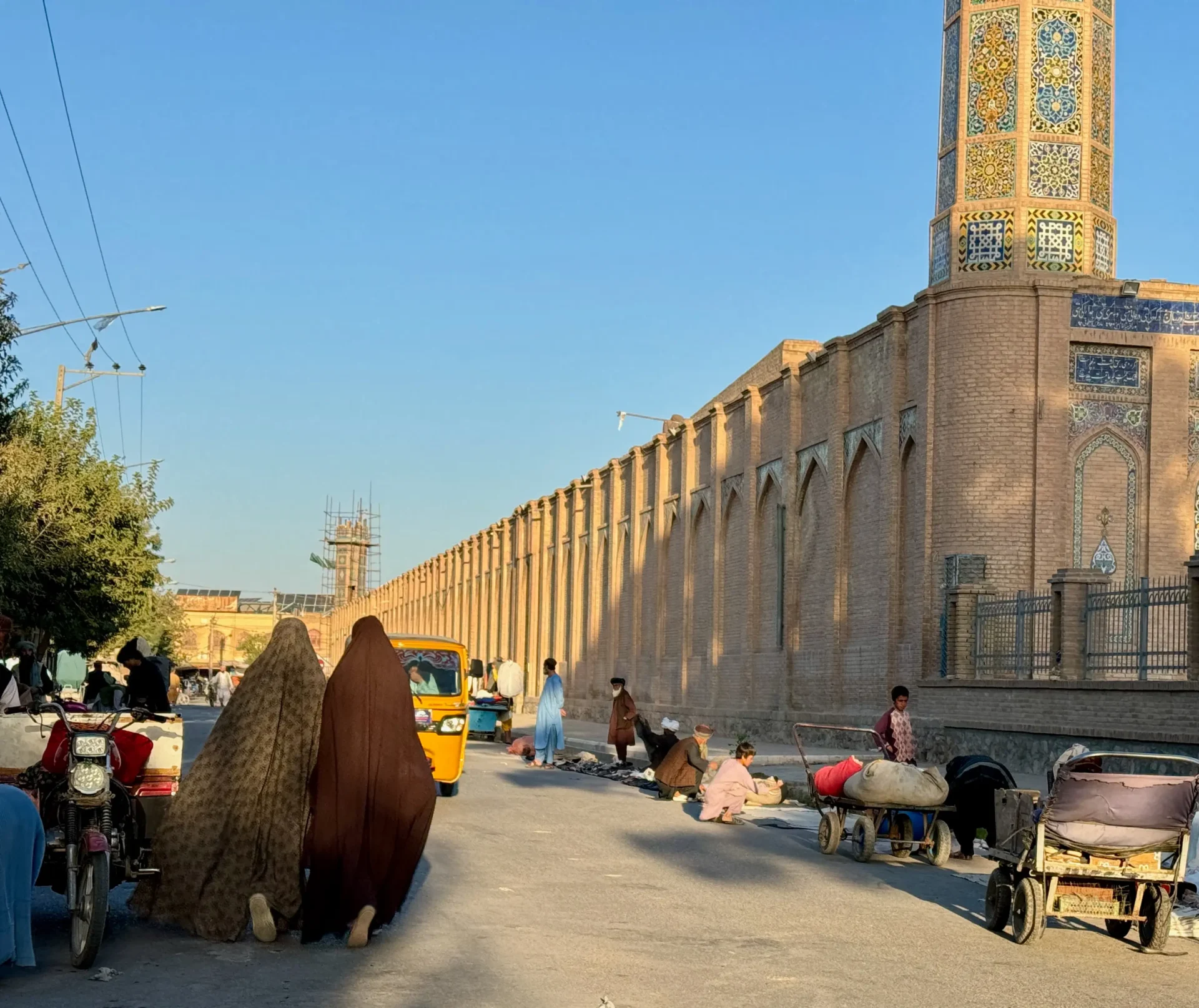 Two women in burqas walking in Herat.